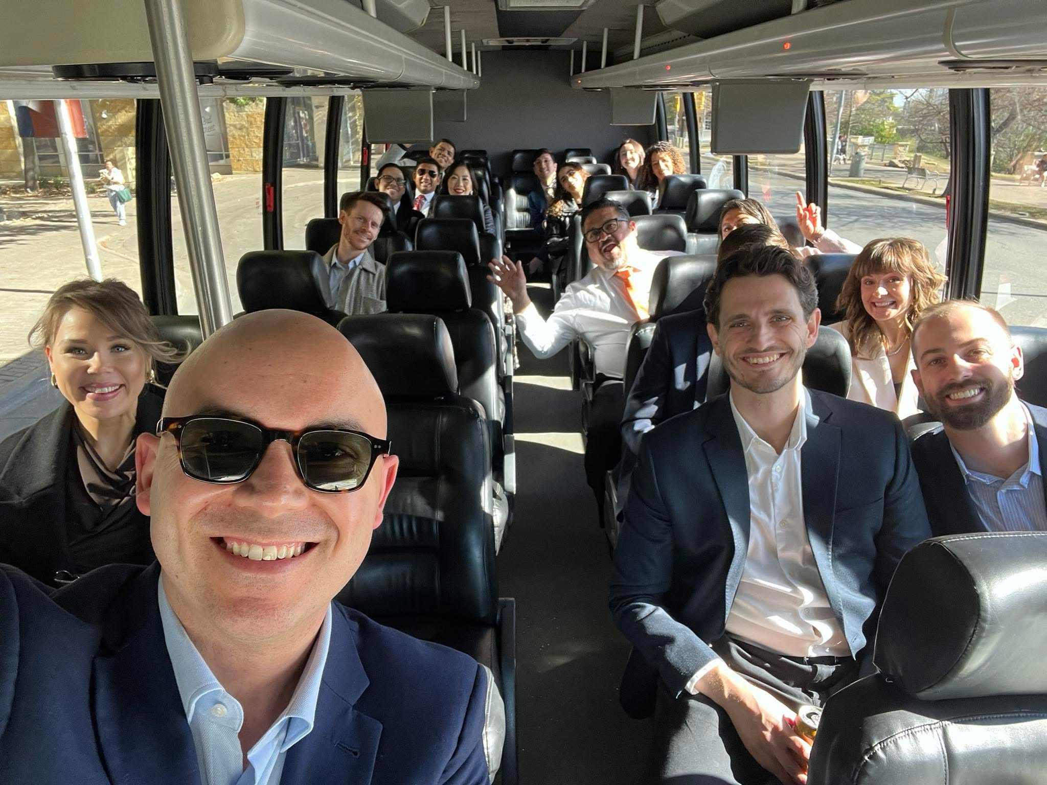 Party bus interior with seating, LED lighting, and cooler